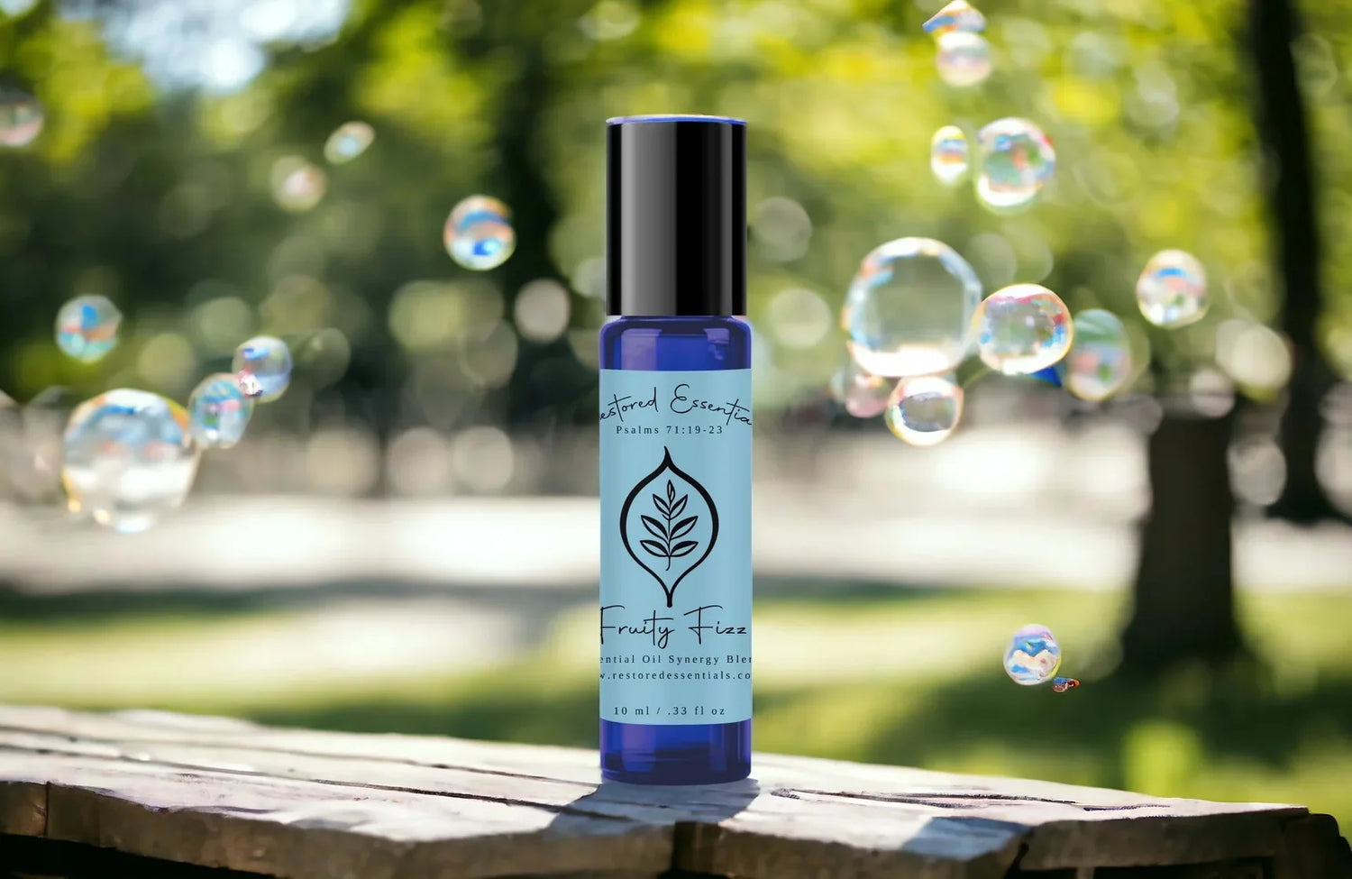 Joy and positivity essential oil blend on table with bubbles