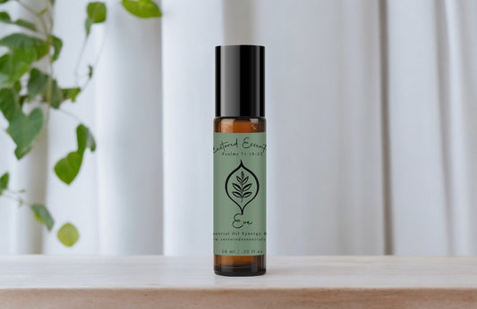 Green Eve bottle on table with white curtain.