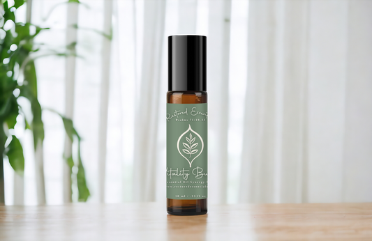 Roller bottle on table with white curtain.