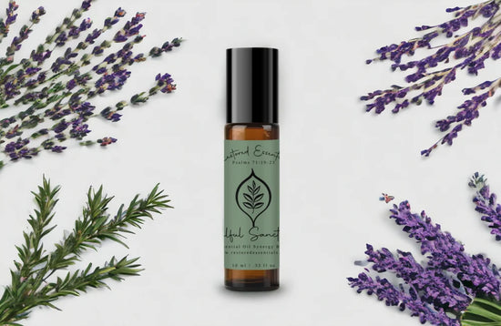 Soulful Sanctuary Essential Oil Roller Blend Bottle surrounded by purple and green plants on a white background.